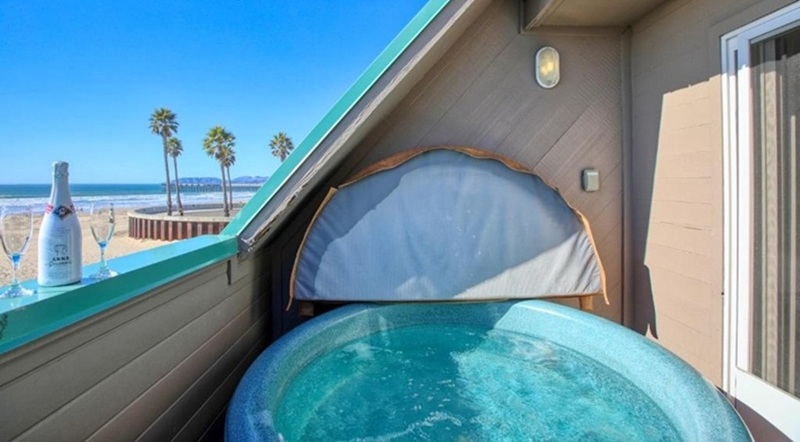 SeaVenture Beach Hotel & Restaurant SeaVenture Beach Hotel balcony hot tub overlooking Pismo Beach with ocean views and pier nearby.